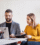 two-business-people-with-wheelchair-in-the-office-PMJT9V5-cropped